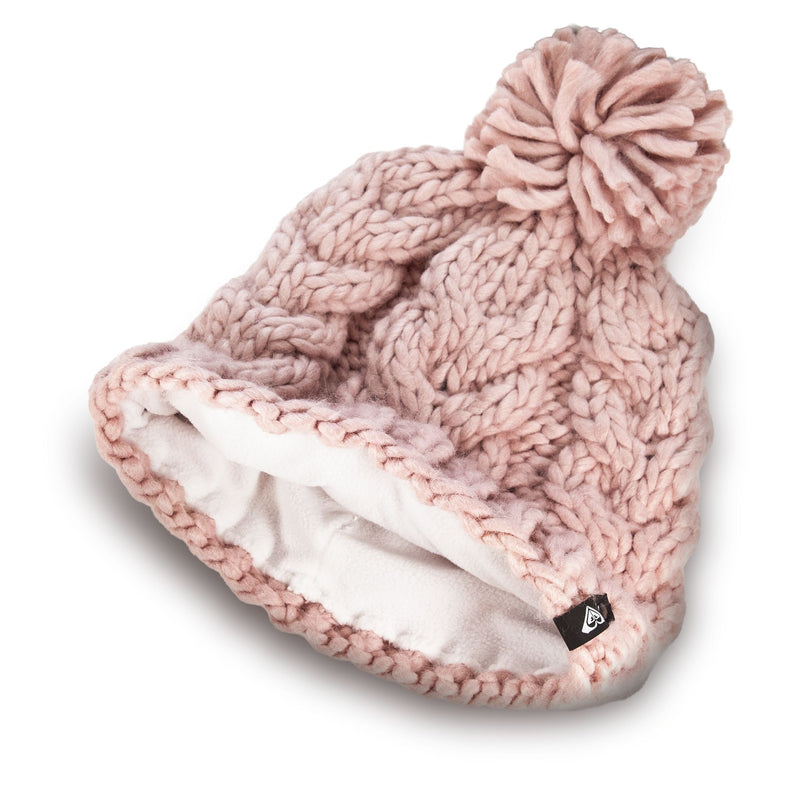 The Roxy Winter Beanie is a chunky knit pink hat featuring a playful pom-pom on top, a soft white fleece lining, and a small black logo tag, shown lying on its side.