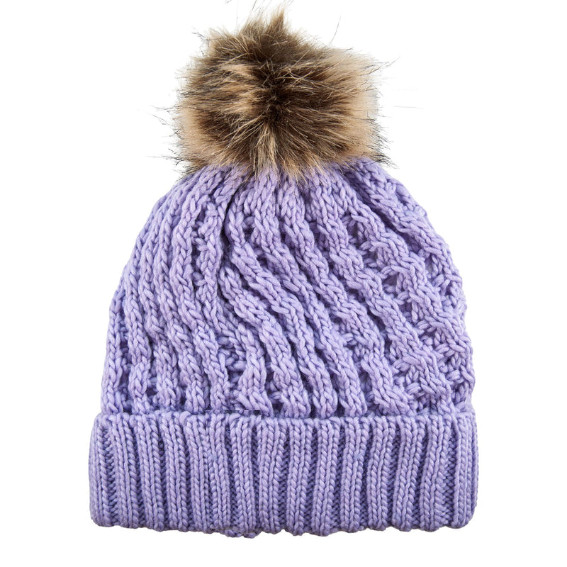 The Roxy Girls Blizzard Girl Beanie by Roxy is a light purple cable knit beanie featuring a ribbed cuff and topped with a brown faux fur pom-pom, shown against a white background.