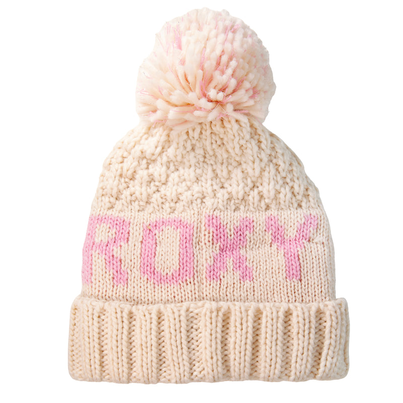 A cream-colored knitted Roxy Girls Tonic Beanie featuring a large pom-pom on top and “ROXY” in pink letters across the front, with a cozy polar fleece-lined interior for ultimate winter style.