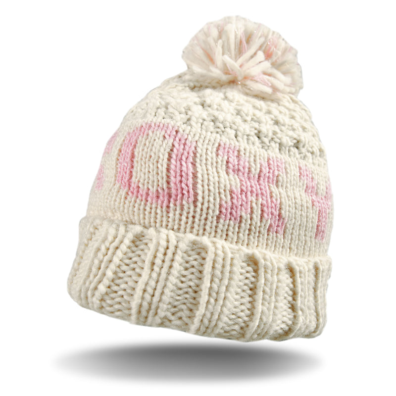 Stay warm in style with the Roxy Girls Tonic Beanie, a cream-colored knit beanie designed with a playful pink pattern, folded brim, and a fun pom-pom on top. Lined with cozy polar fleece for extra comfort and warmth, this Roxy accessory is perfect for chilly days. Shown against a white background with a shadow beneath, the Roxy Girls Tonic Beanie adds the perfect winter touch to any outfit.