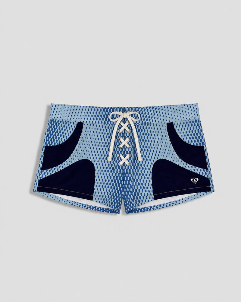 The Roxy Blake Shorts are light blue swim shorts featuring a white drawstring, navy curved side accents, a textured dot pattern, and a small white heart logo. Made from soft cotton-blend fabric for all-day comfort.