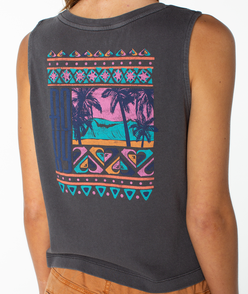 A person wearing a sleeveless black Oceanview Wildflower Tank by Roxy, featuring colorful geometric patterns and a tropical beach scene with palm trees and waves printed on the back, adding a touch of beachy chic to their tomboy style.