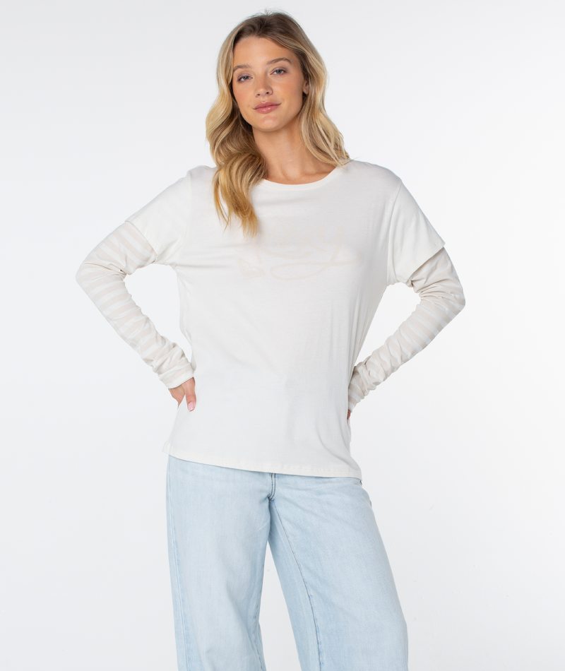 Woman with long blonde hair wears a Vintage Roxy Two-fer Top by Roxy and light blue jeans, standing with hands on hips against a plain white background.