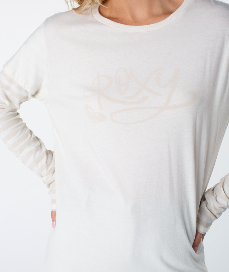Person wearing a Vintage Roxy Two-fer Top—white long-sleeve with faint arm stripes and Roxy in light script—hands on hips, head partially out of frame.