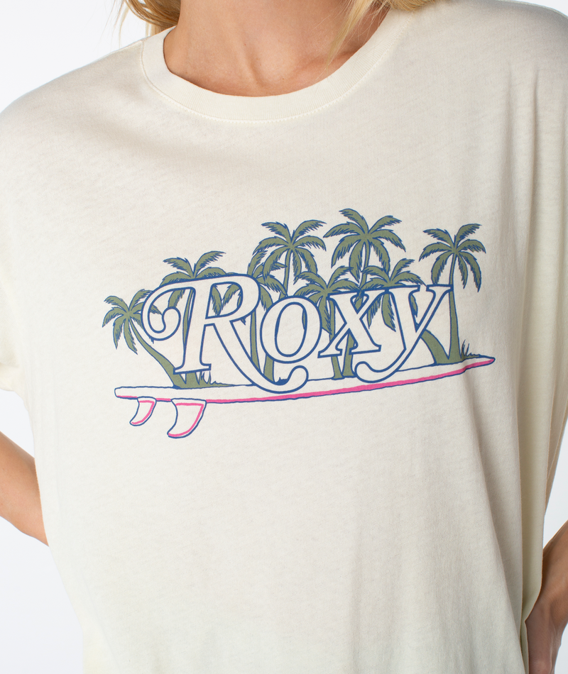 Cream-colored Roxy Sunny State Tee featuring an oversized fit with a graphic of palm trees, a surfboard, and cursive text for a beachy-chic look.