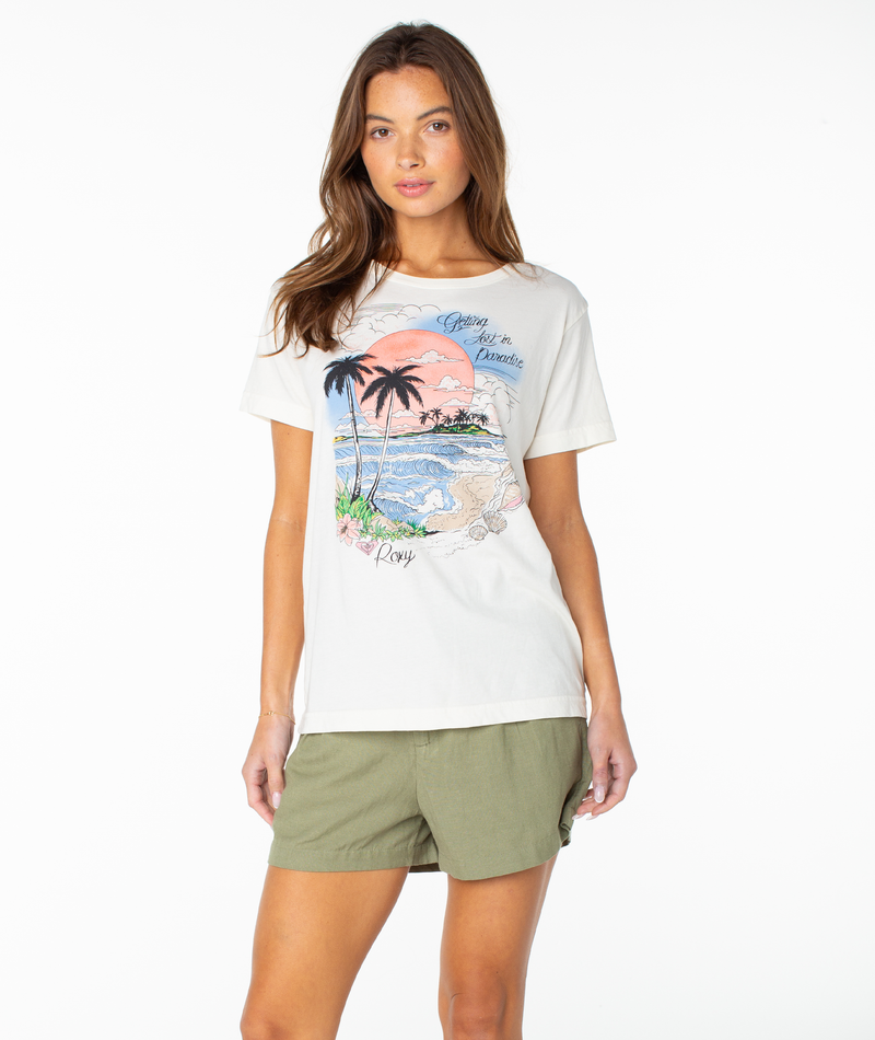 A woman with long brown hair is wearing the Roxy Coastal Beach Boyfriend Crew in Cloud Dancer Coastal Beach, standing against a plain white background.