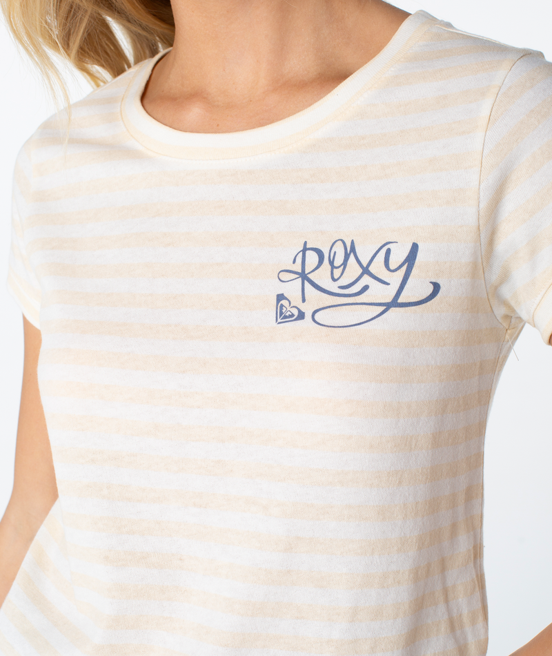 A person wearing the Vintage Roxy Stripe Top—cream and white stripes with ROXY and a small heart logo on the chest. Only their upper torso is visible.