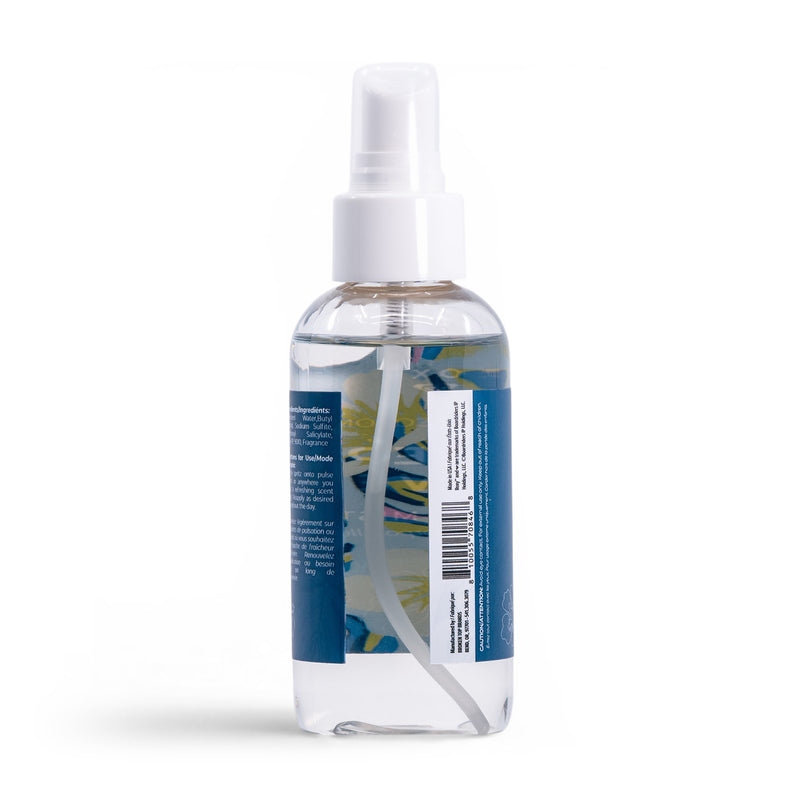 A clear plastic spray bottle with a white nozzle and cap holds Deep Dive Body Mist by Roxy. The blue label, featuring white text and a barcode, evokes fresh coastal air, all set against a plain white background.