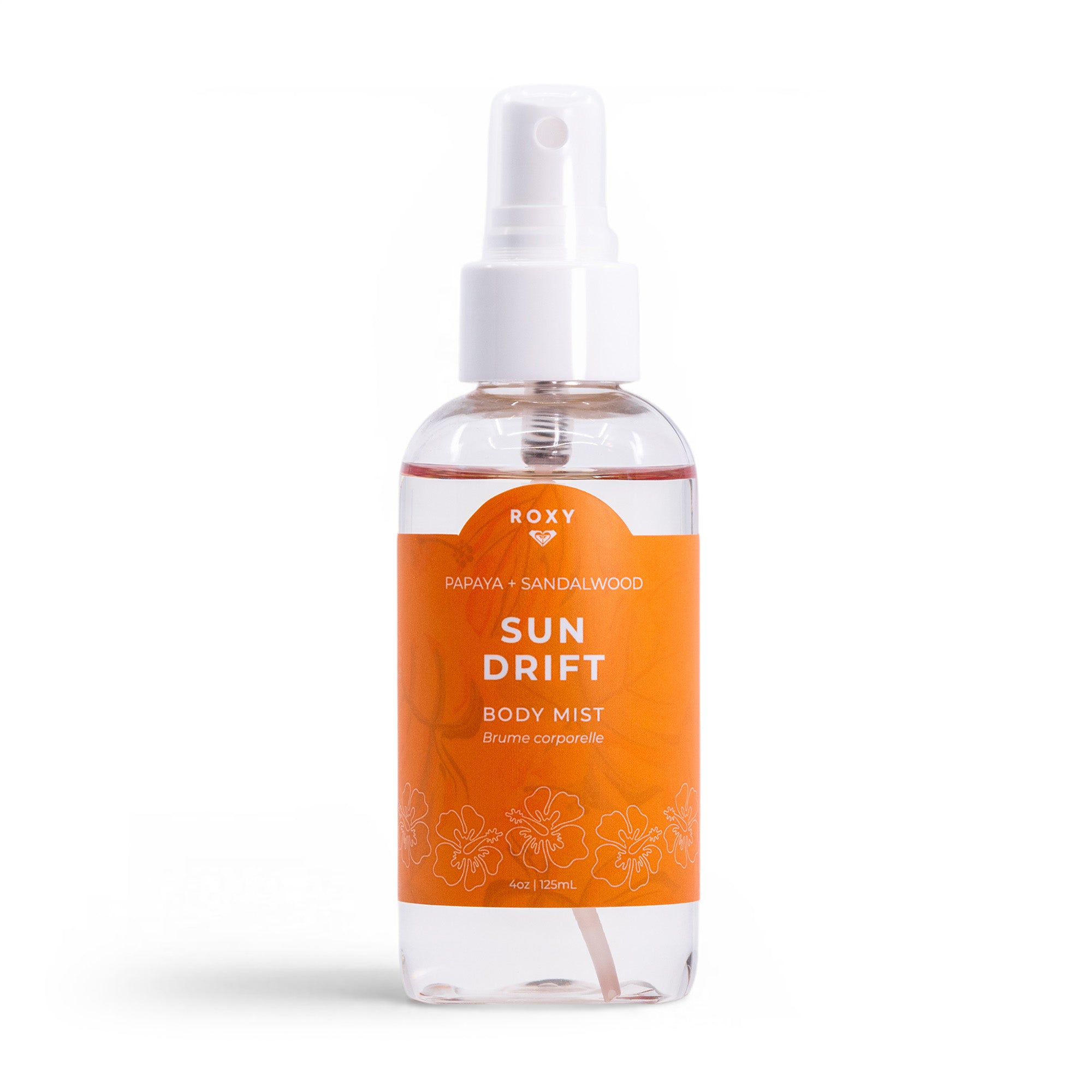 A clear spray bottle labeled Roxy Sun Drift Body Mist features an orange floral label with white text, a white spray nozzle and cap, and a papaya, guava, and sandalwood scent.