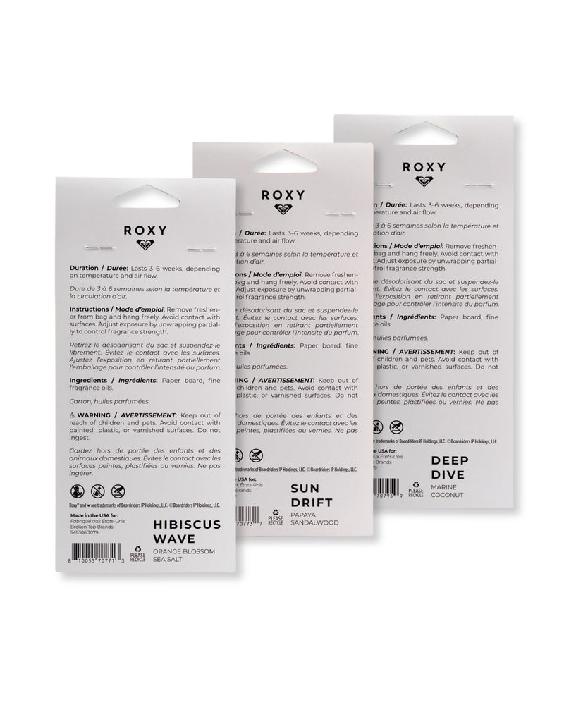 Three ROXY Air Freshener 3-Pack Variety Pack packages are shown from the back, displaying product details, warnings, ingredients, and fragrance names—Hibiscus Wave, Sun Drift, and Deep Dive—all offering refreshing coastal scents ideal for enhancing your favorite car fragrance experience.