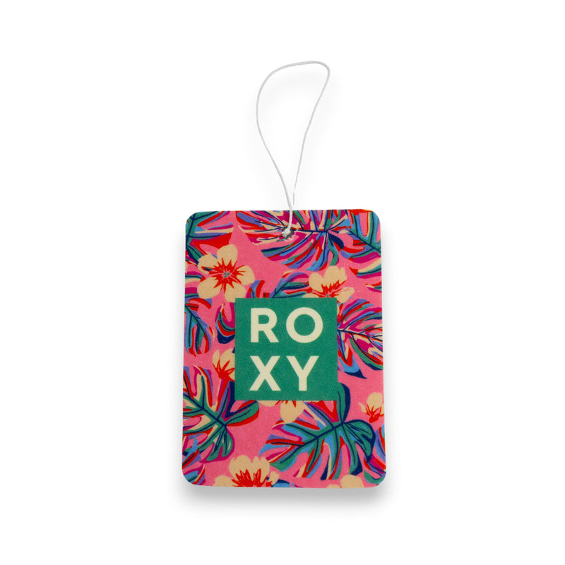 The Roxy Hibiscus Wave Palm Air Freshener features a tropical floral design in pink, red, blue, and green with bold white ROXY lettering on a green square, a white hanging string, and releases a refreshing coastal scent.