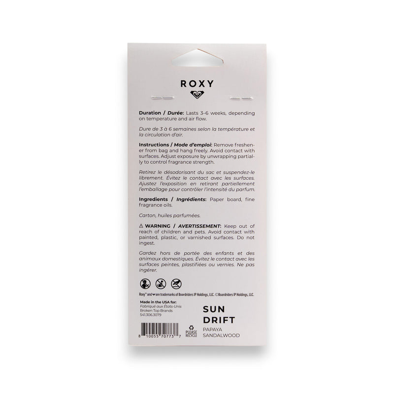 Back of a ROXY Sun Drift Palm Air Freshener package with instructions, warnings, and scent info—featuring the sunlit papaya sandalwood fragrance—in English and French on a white background with black text and icons.