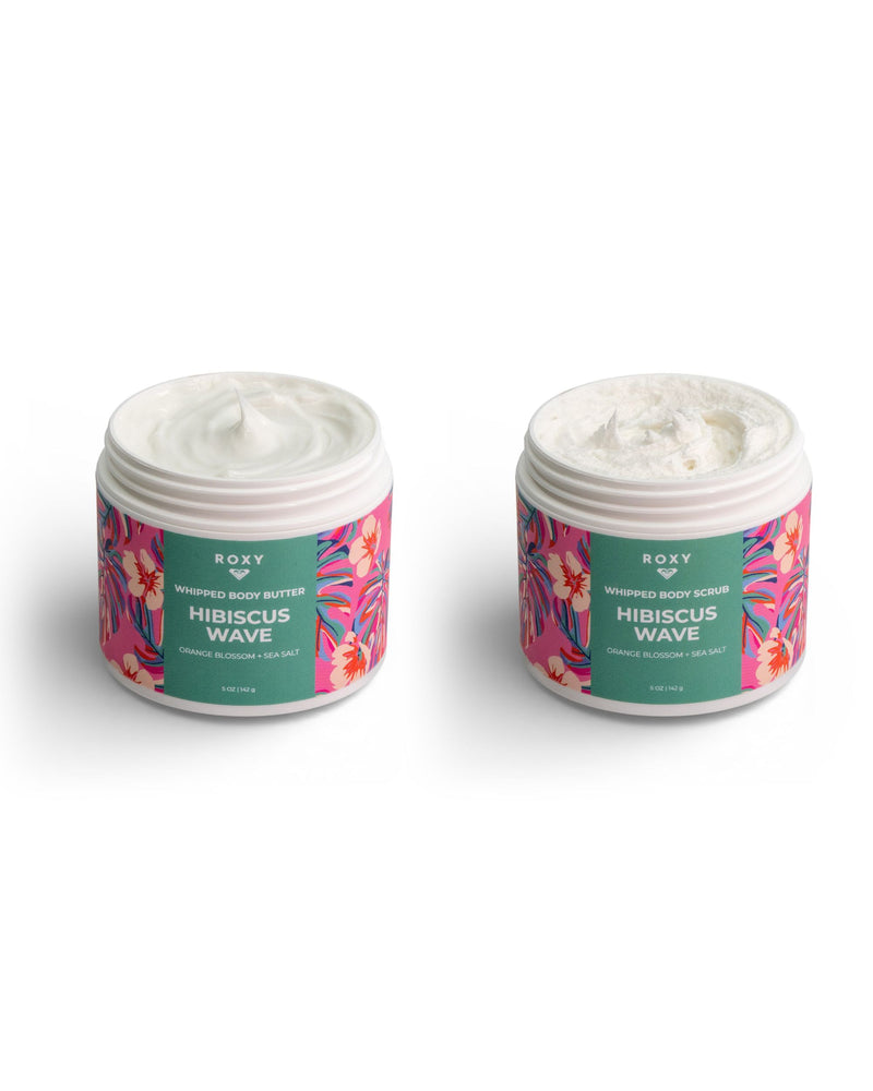 Two open tubs from the ROXY Hibiscus Wave Body Butter & Scrub Bundle, each featuring vibrant floral labels. The tub on the left holds the body butter with its silky texture, while the one on the right contains body scrub with a gently exfoliating feel. Specially blended with Hibiscus Wave, this bundle is designed to exfoliate, hydrate, and smooth your skin for a radiant glow.