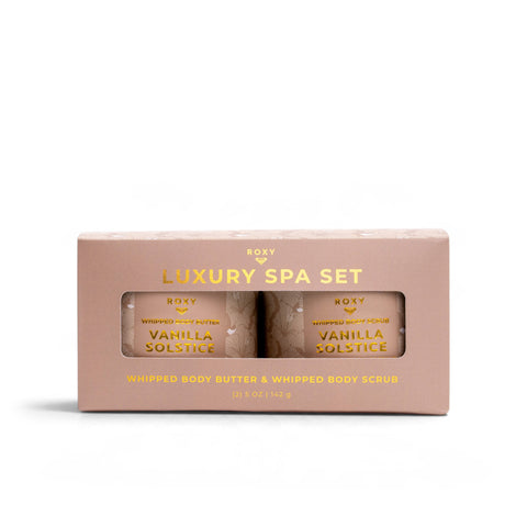 A Vanilla Solstice Holiday Luxury Spa Set box containing a jar of whipped body butter and a jar of whipped body scrub.