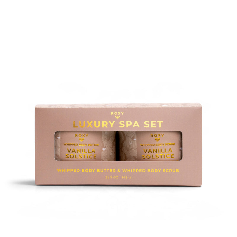 A Vanilla Solstice Holiday Luxury Spa Set box containing a jar of whipped body butter and a jar of whipped body scrub.