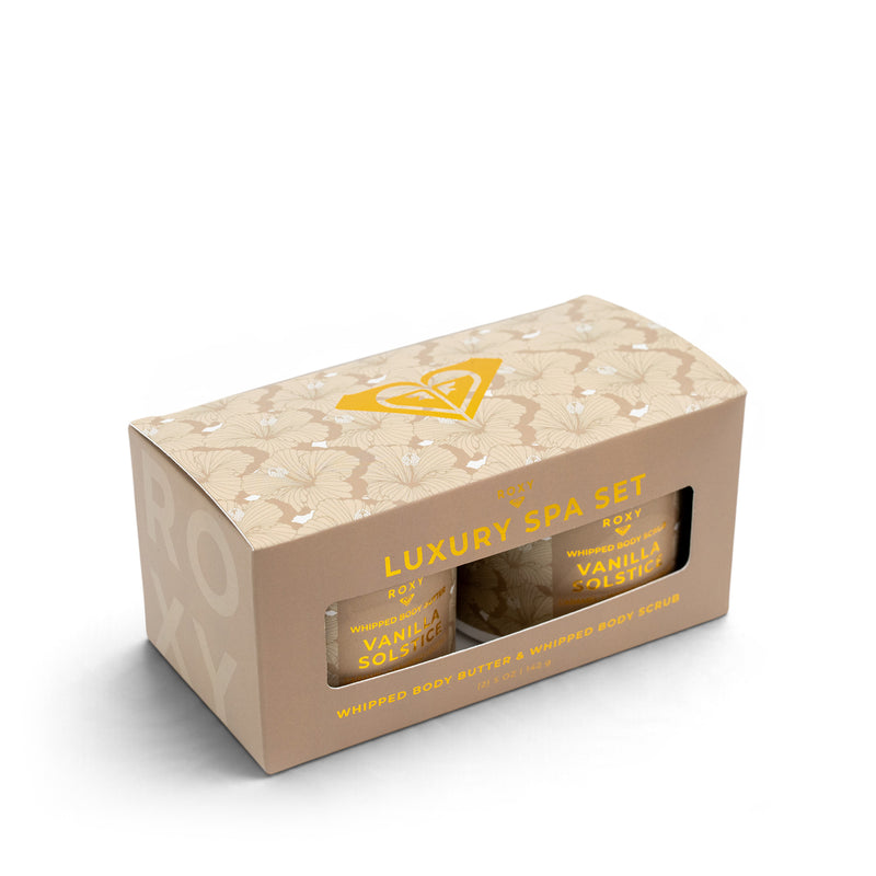 A beige gift box with a floral pattern containing a ROXY Vanilla Solstice Holiday Luxury Spa Set with body butter and body scrub.