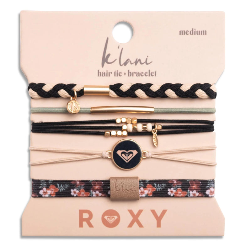 A set of five K'lani x Roxy Hair Tie Bracelets, in black, beige, and gold tones. Features braided textures, floral accents, surf-inspired details, and comes displayed on a Roxy card.
