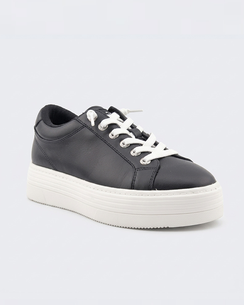 The Roxy Sheilahh 2.0 Sneaker, featuring a black upper, white laces, and a thick white platform sole, is displayed on a plain light background and faces slightly to the right.