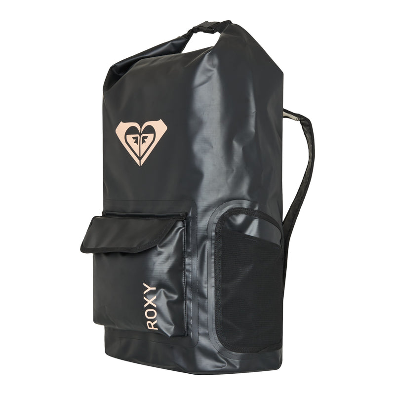 The Need It Backpack by Roxy is a black backpack featuring a front flap pocket, a side mesh pocket ideal for storing surf gear or a wetsuit, and a top handle. The Roxy logo is printed in white on the upper front, with “ROXY” written vertically near the bottom.