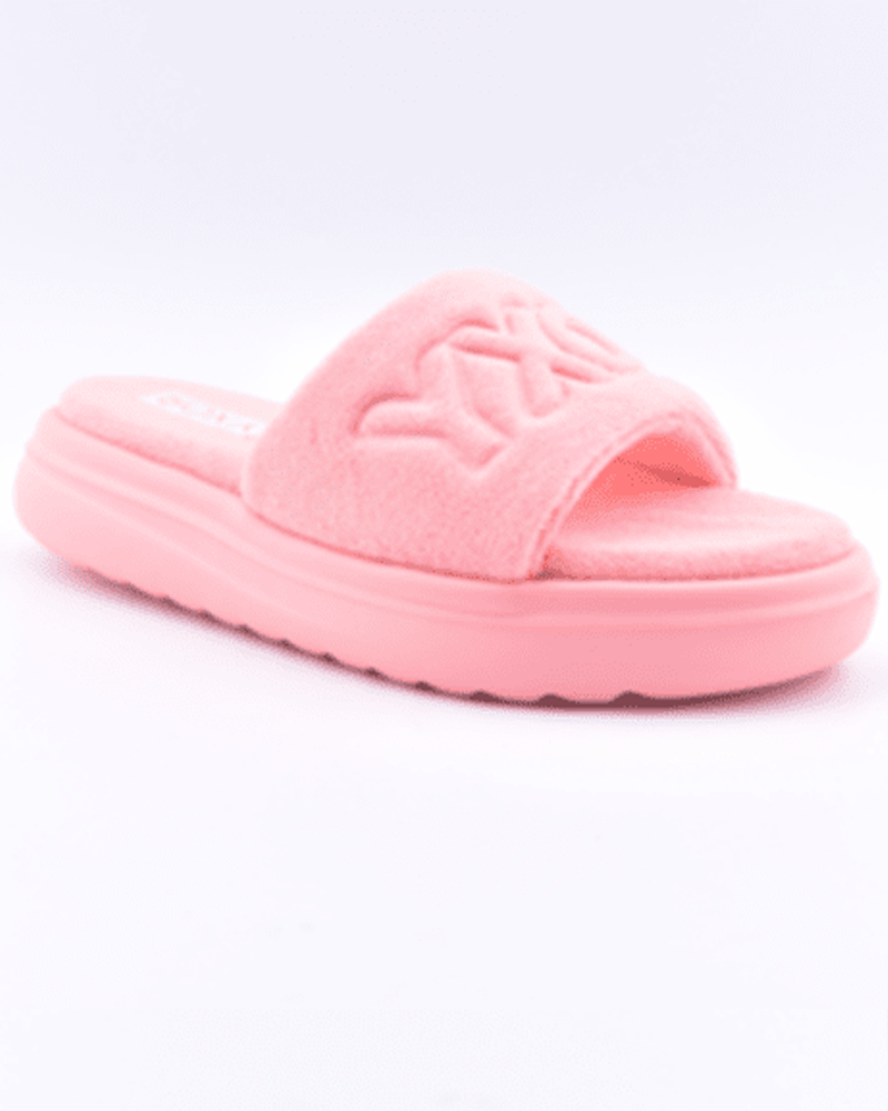 The Roxy Gelato Sandal is a single pink fuzzy slide featuring a wide strap and thick, textured sole, shown on a white background.