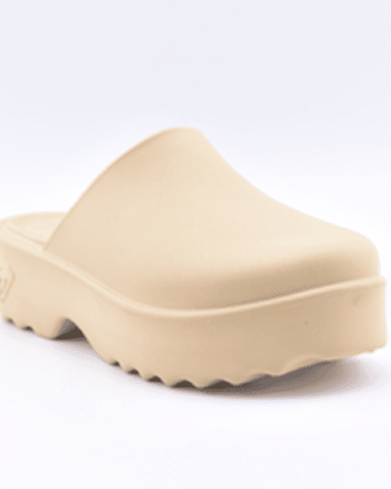 The Roxy Maddy Clog is a beige slip-on with a thick, textured sole and closed toe, shown against a plain white background.