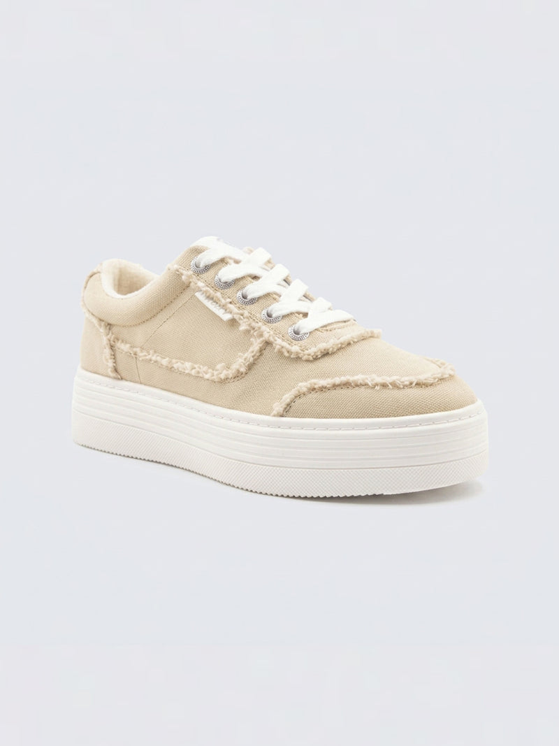 The Roxy Sheilahh 2.0 Sneaker features beige canvas with frayed edges, white laces, silver eyelets, and a chunky white platform sole, shown against a light background.