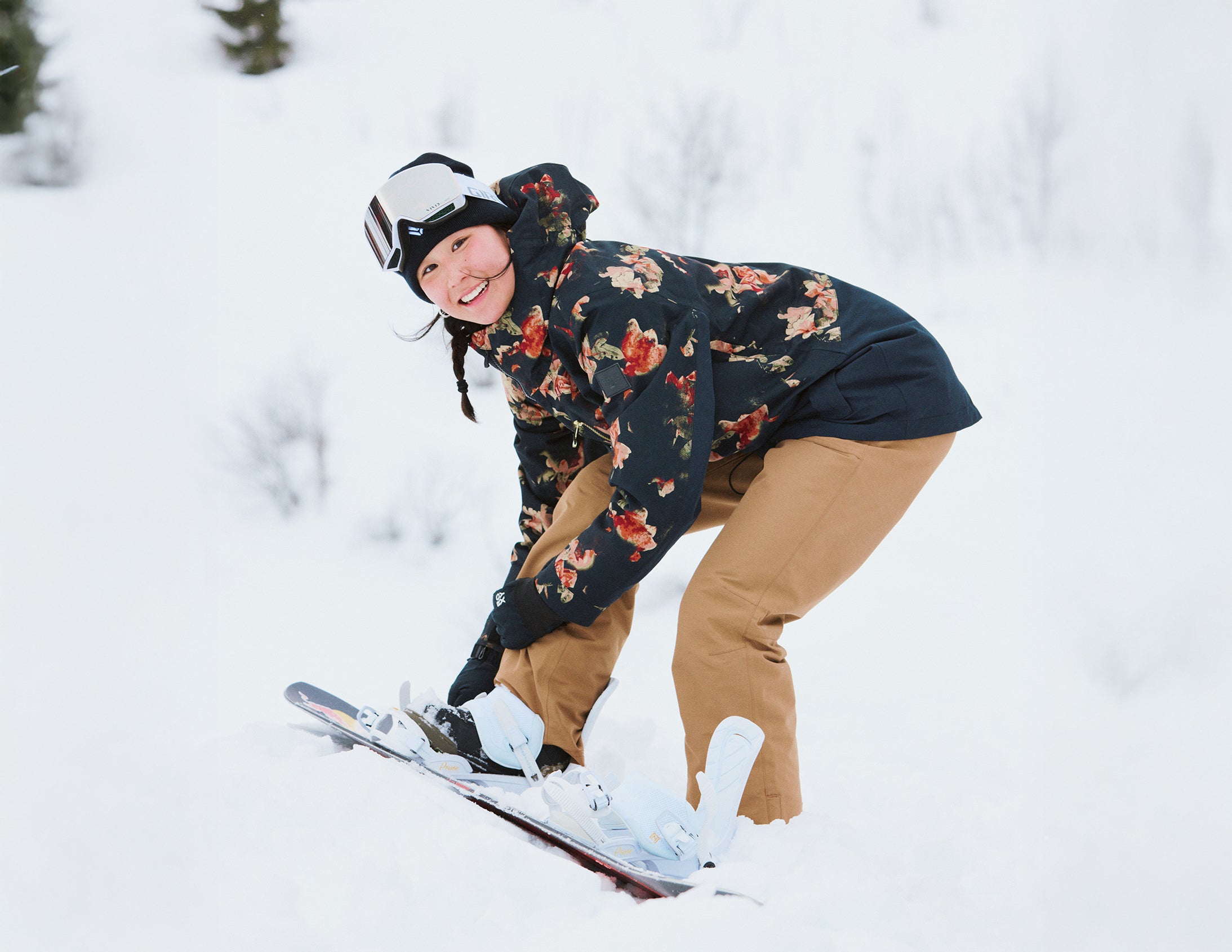 Person snowboarding in a snowy landscape